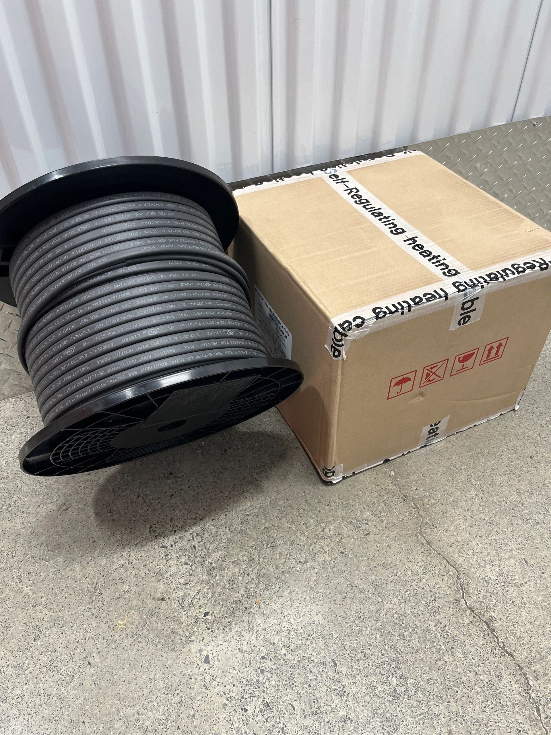 500 ft. of Self-Regulating Heat Trace Cable - 5 watts per foot, 120 volts or 208-277 volts next to a cardboard box